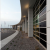 The predetermined location and orientation of the building posed a thermal problem... The solution became the centerpiece of the project's daylight-harvesting strategy. Gray installed a 4,900-sq.-ft SageGlass® electrochromic (electronically tintable) glass wall on the west façade of the office building, which is tied to the building energy management system and automatically tints based on sunlight and measured solar heat gain.